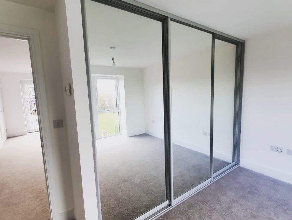 triple door floor to ceiling glass wardrobe