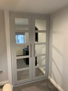 grey and mirrored fitted wardrobe