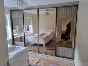 Mirrored design wardrobes by glide and slide