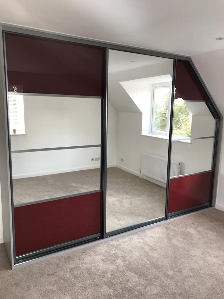 Red panel and mirrored Crittall wardrobe